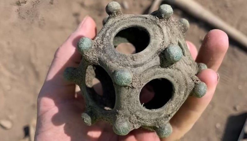 The newly discovered dodecahedron photographed during the dig. Credit: Norton Disney Archaeology Group